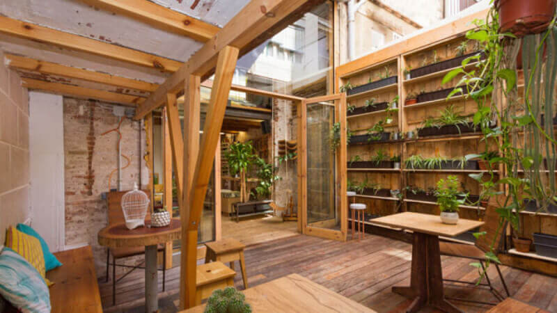 Garden room in restaurant filled with wood finished with Rubio Moncoat.