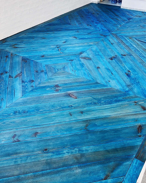A chevron floor finished with a bright blue hardwax oil, Rubio Monocoat Sapphire.