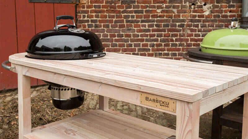 Wooden BBQ carts that hold your charcoal barbeque.
