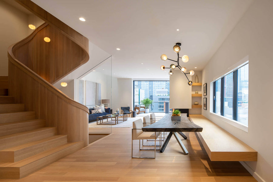 Room with rift sawn wood flooring and staircase, finished with a natural oil wood finish.