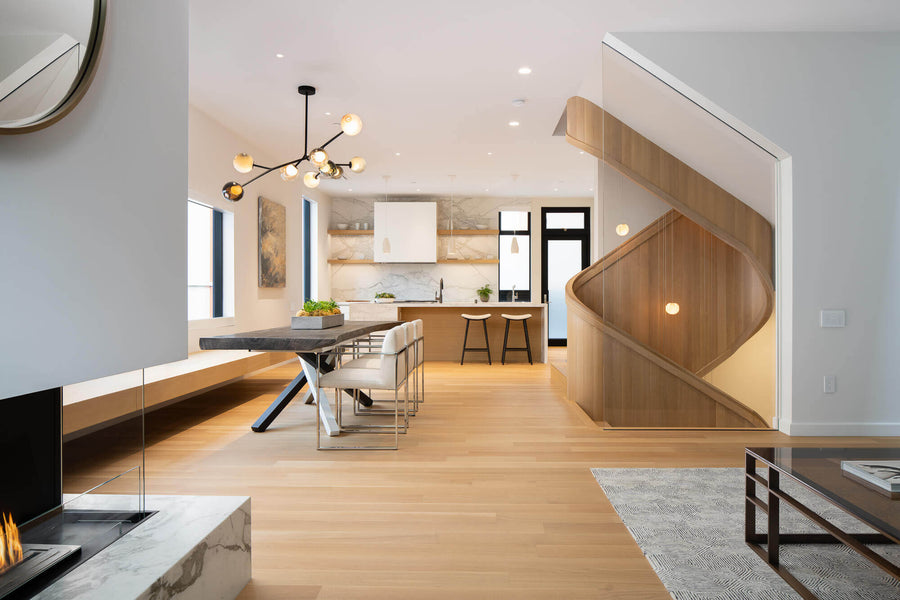 Rift sawn white oak flooring in living room and on spiraling staircase in townhome.