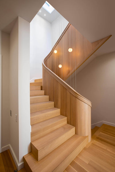 Beautiful rift sawn white oak spiraling staircase finished with Rubio Monocoat's oil based wood finish.