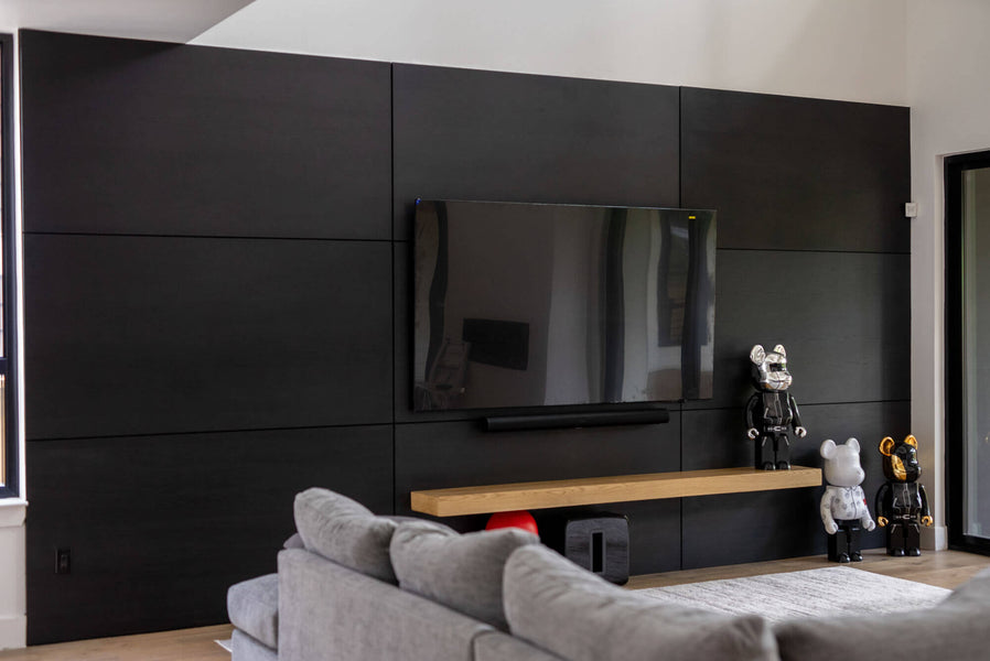 A different view of a black stained paneled white oak wall finished with Rubio Monocoat products.