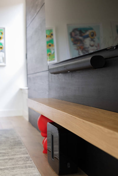 A detailed image of a fireplace mantle wood beam.