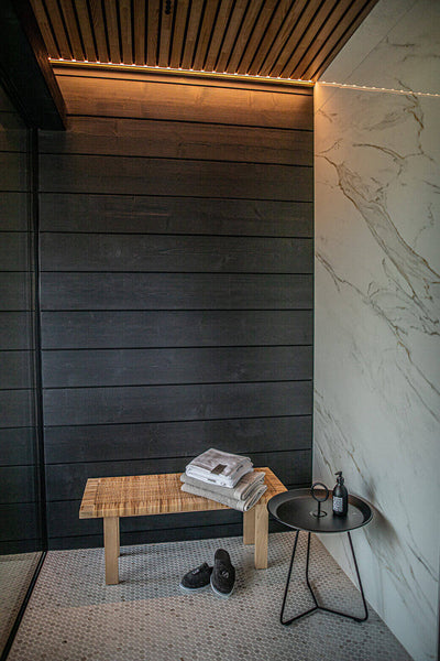 Ready nook with wood paneling and marble accent wall