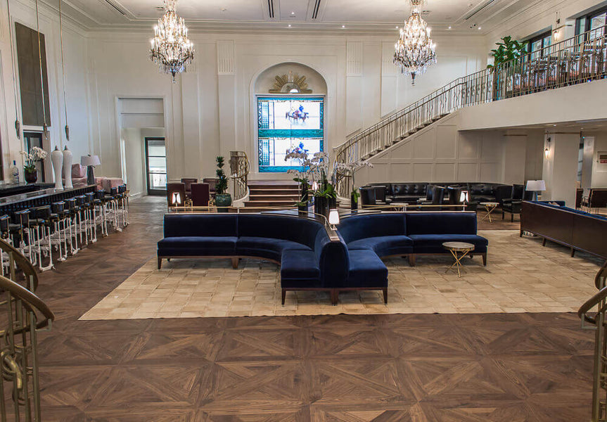 Parquet flooring made out of walnut wood and finished with a matte wood finish.