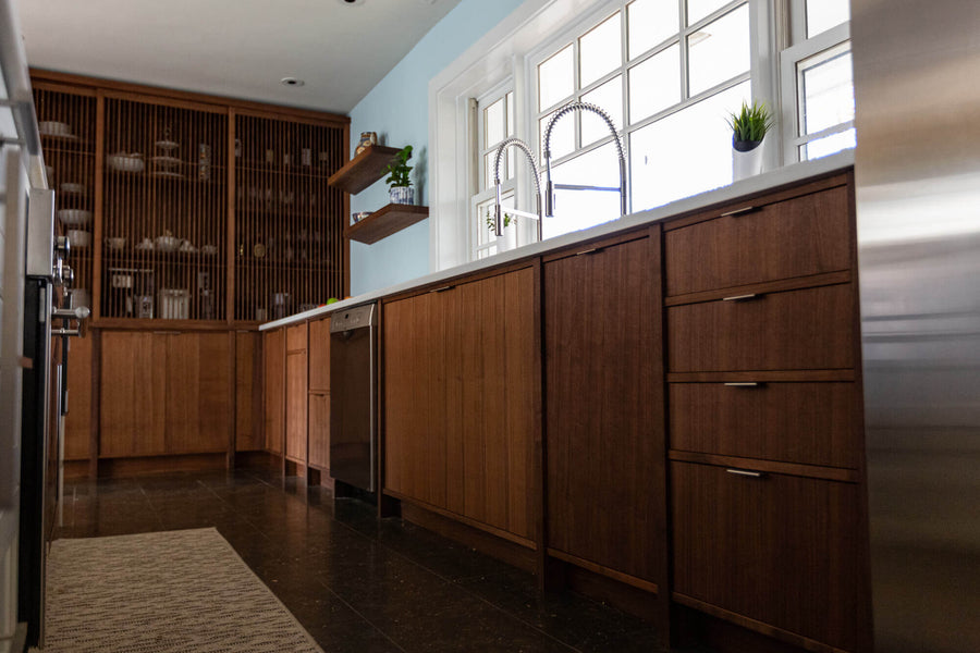Walnut cabinetry in a mid-century modern kitchen.