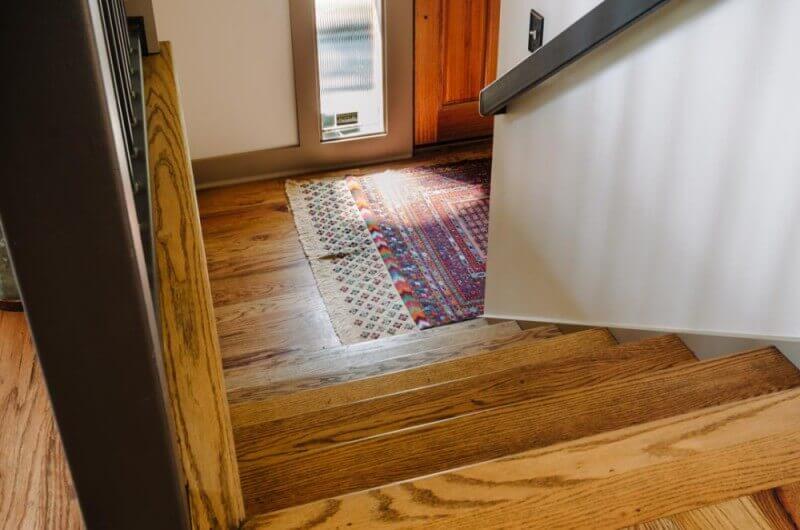 Front door features hardwood flooring finished with Rubio Monocoat.