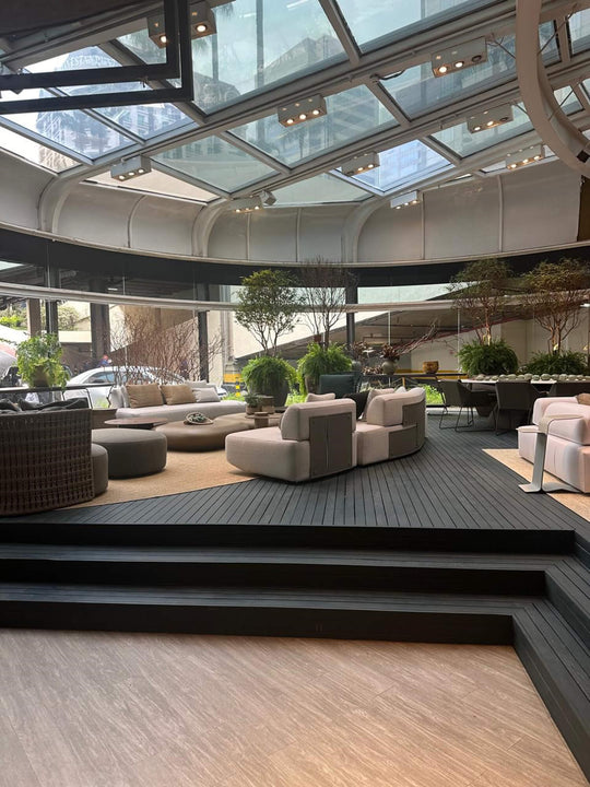 A green wood deck in a home furnishing show room. The deck was finished with Rubio Monocoat DuroGrit "Rubio Monocoat Green".