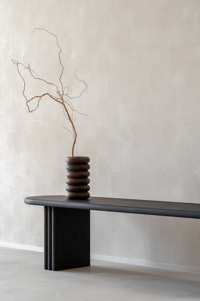 A hand-turned vase made from oak wood treated with Rubio Monocoat Precolor Easy Intense Black and Oil Plus 2C "Pure".
