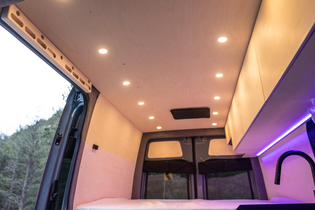 Ceiling of a camper van with birch wood finished with Rubio Monocoat Oil Plus 2C hardwax oil wood stain and finish can be seen.