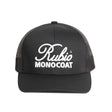 Black cap with Rubio Monocoat logo on a white surface