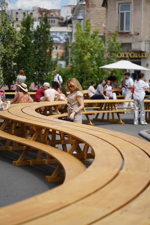 A large winding outdoor table meant for a crowd finished with DuroGrit exterior wood stain and finish in one.