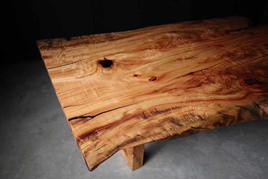 The top of a figured wood coffee table made from Camphor wood.