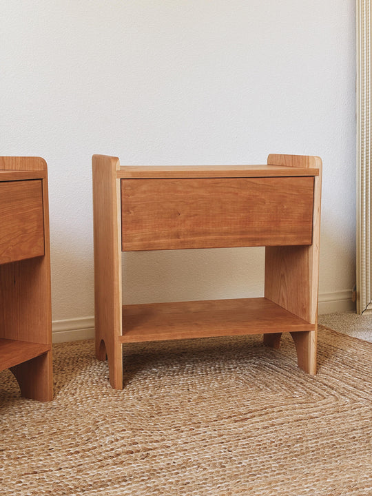 Close-up detail of two solid cherry nightstands showing rounded corner edges and wood grain, finished with Rubio Monocoat Oil Plus 2C Pure single coat hardwax oil finish.
