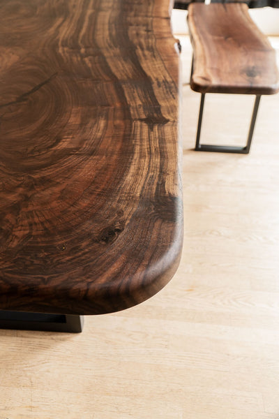Stunning wood grain in a claro walnut dining table.