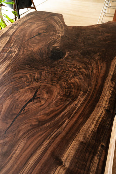 A highly figured claro walnut dining table top finished with Rubio Monocoat Oil Plus 2C.