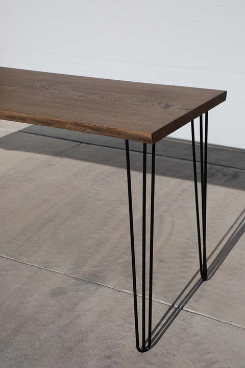 A slab-style dining table finished with Rubio Monocoat Oil Plus 2C hardwax oil wood stain and finish.