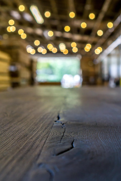 Close up of the charred grain on a white oak table.