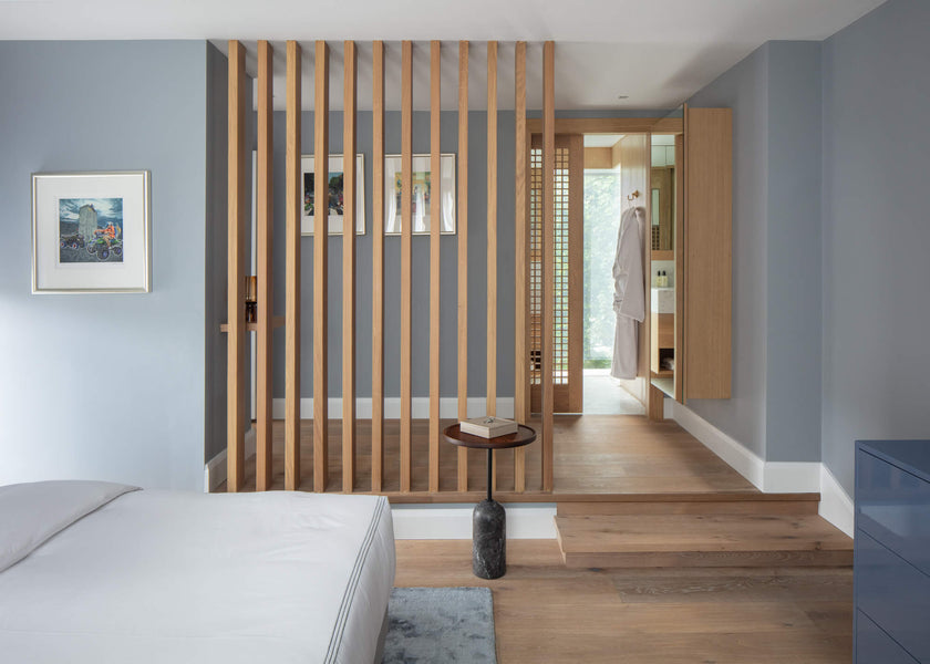 Wood slat wall, mirror wall cabinet, wood trim and pocket door all crafted from oak and finished using Rubio Monocoat Oil Plus 2C Natural interior hardwax oil wood stain and finish in one.
