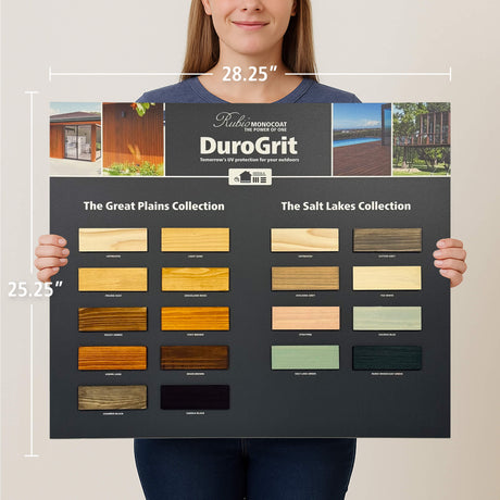 Person holding a DuroGrit color swatch chart with various wood sample colors.