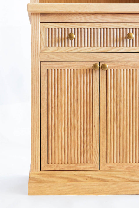 Fluted details on the drawer and door fronts of a red oak cabinet finished with Oil Plus 2C "Dunes".