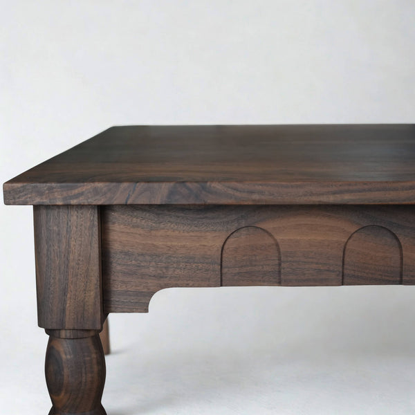 A custom walnut dining table with European inspired detail finished with Rubio Monocoat Oil Plus 2C hardwax oil wood stain and finish.