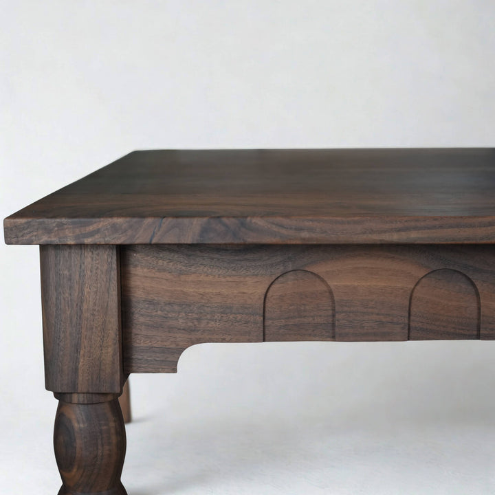 A custom walnut dining table with European inspired detail finished with Rubio Monocoat Oil Plus 2C hardwax oil wood stain and finish.