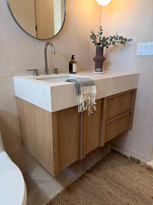 White oak bathroom vanity with integrated sink, finished in Rubio Monocoat Oil Plus 2C Natural.