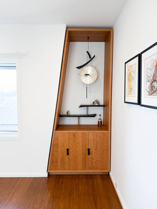 A Japanese-inspired whiskey cabinet made from cherry and ash woods finished with Rubio Monocoat Oil Plus 2C hardwax oil wood stain and finish.