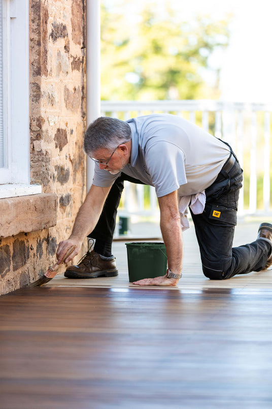 Man using an easy to apply deck stain and finish