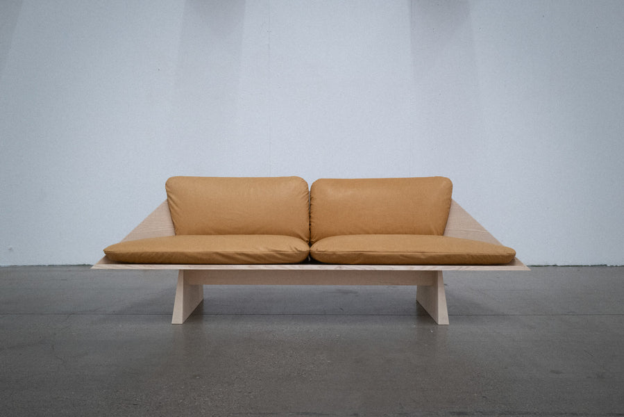 Ash sofa finished with Rubio Monocoat Oil Plus 2C with brown leather cushions.