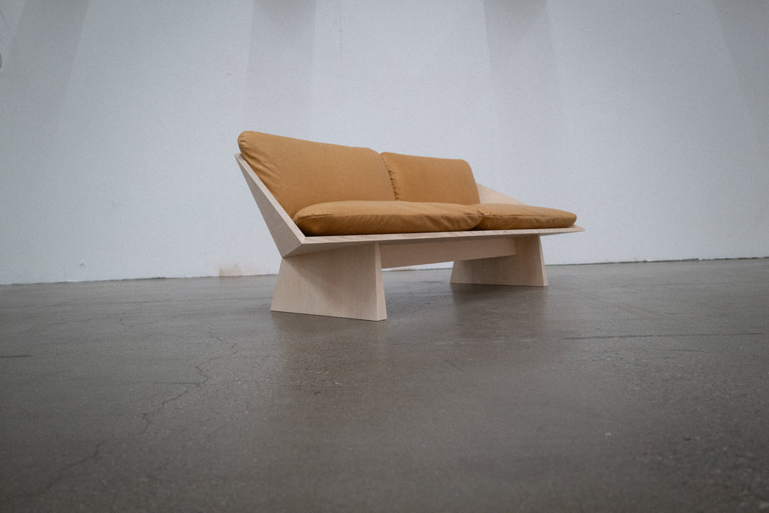 A geometric sofa made from ash finished with Rubio Monocoat Oil Plus 2C hardwax oil wood stain and finish.
