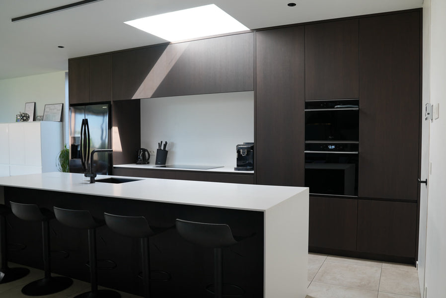 Dark brown oak cabinetry finished with Precolor Easy Mystic Brown wood pretreatment and Oil Plus 2C Black wood finish.