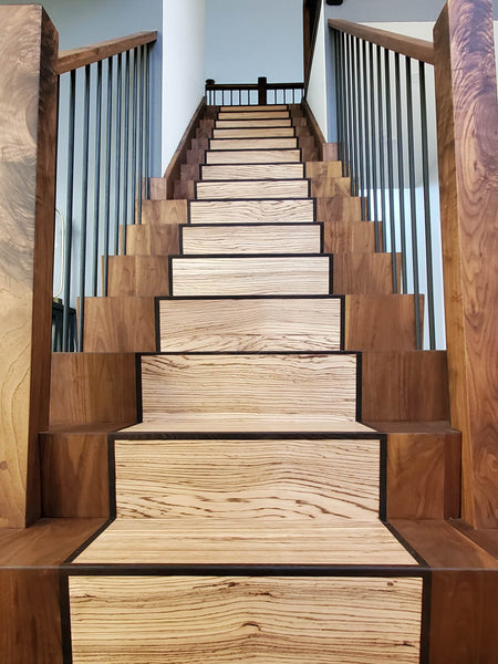 Looking up a mixed wood species staircase finished with Rubio Monocoat Oil Plus 2C hardwax oil. 