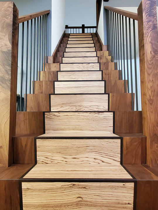 Looking up a mixed wood species staircase finished with Rubio Monocoat Oil Plus 2C hardwax oil.