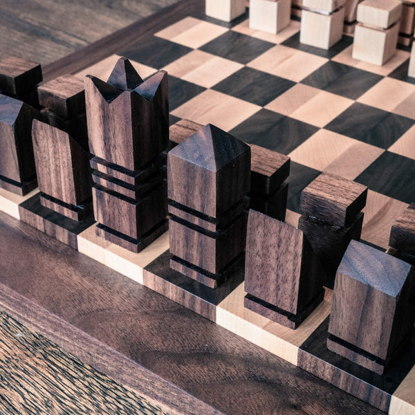 A close up shot of walnut chess pieces finished using Rubio Monocoat Oil Plus 2C "Pure".