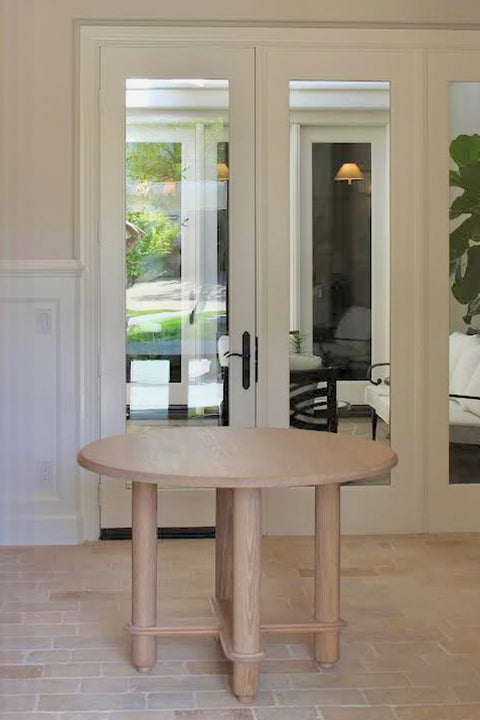 Small, round white oak entry table finished with a hardwax oil wood finish.