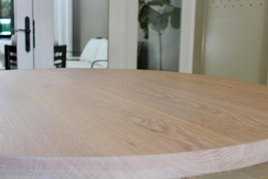 White oak table top finished with a light colored hardwax oil wood finish.