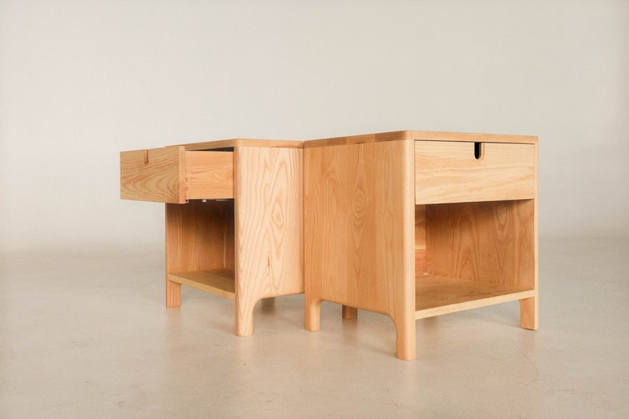 Two ash side tables sitting next to one another. One has a drawer ajar and the other is closed. The side tables were finished with Oil Plus 2C "Natural". 