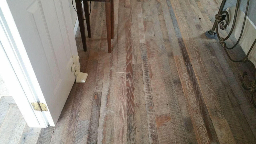 Reclaimed barnwood flooring finished with Oil Plus 2C in the color White.