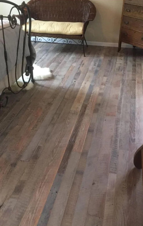 Reclaimed barnwood flooring finished with a hardwax oil wood finish.