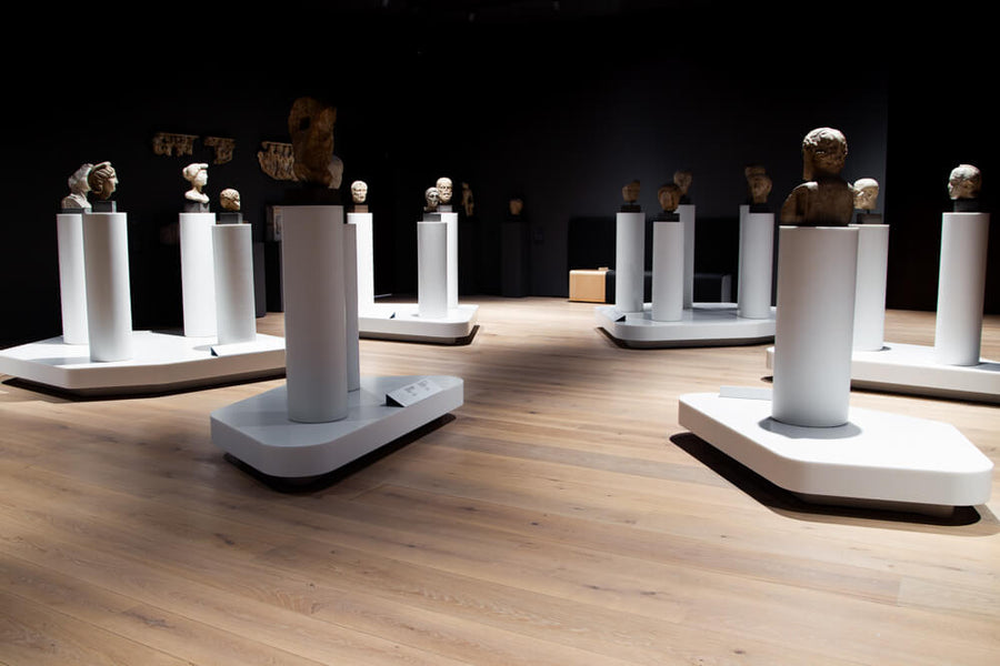 Busts on pedestals at the Norwegian National Museum scattered around a hardwood floor finished with Rubio Monocoat hardwax oil finish.