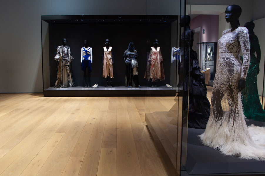 Several dresses on display mannequins at the Norwegian National Museum. 