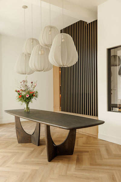 A large, unique dining table made from oak and finished with Rubio Monocoat Oil Plus 2C hardwax oil wood stain and finish.