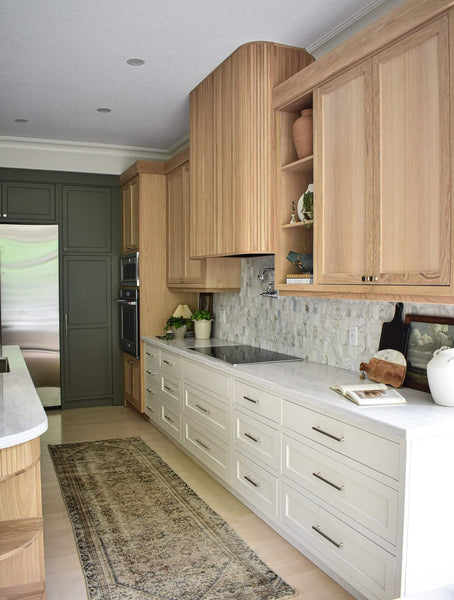 An organic modern kitchen with a white oak vent hood finished with Rubio Monocoat Oil Plus 2C "Natural".