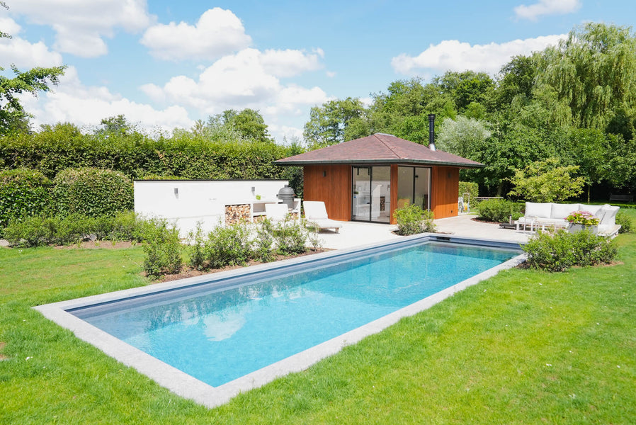 A modern pool and pool house with wood cladding finished using DuroGrit "Foxy Brown".