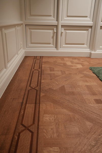 Parquet wood floor laid in a Versailles pattern finished with a custom Oil Plus 2C color mix.