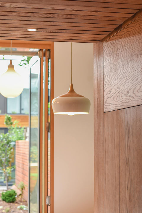 Light fixtures in a modern home with a variety of oak millwork finished with Rubio Monocoat Oil Plus 2C.