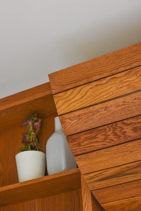 A close up of wood shelving and a wood ceiling treatments finished with a hardwax oil wood finish.